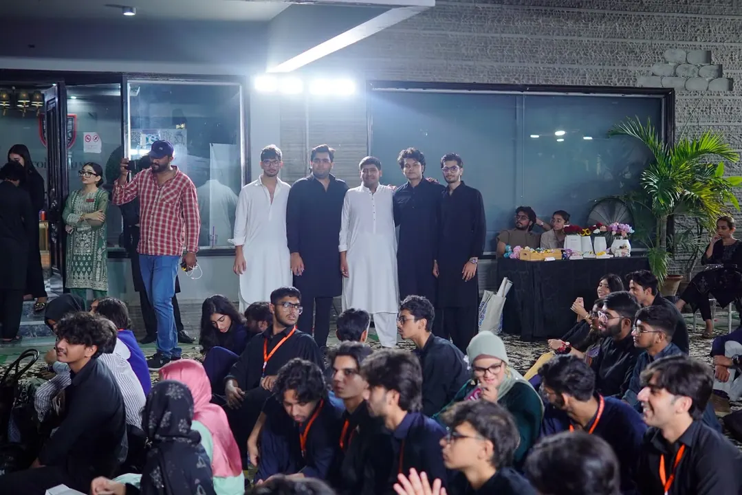 Delegates and team members gathered outdoors in the evening