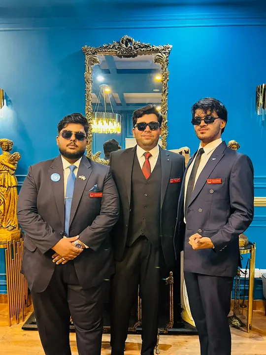 Three ELARA MUN I team members in suits and sunglasses